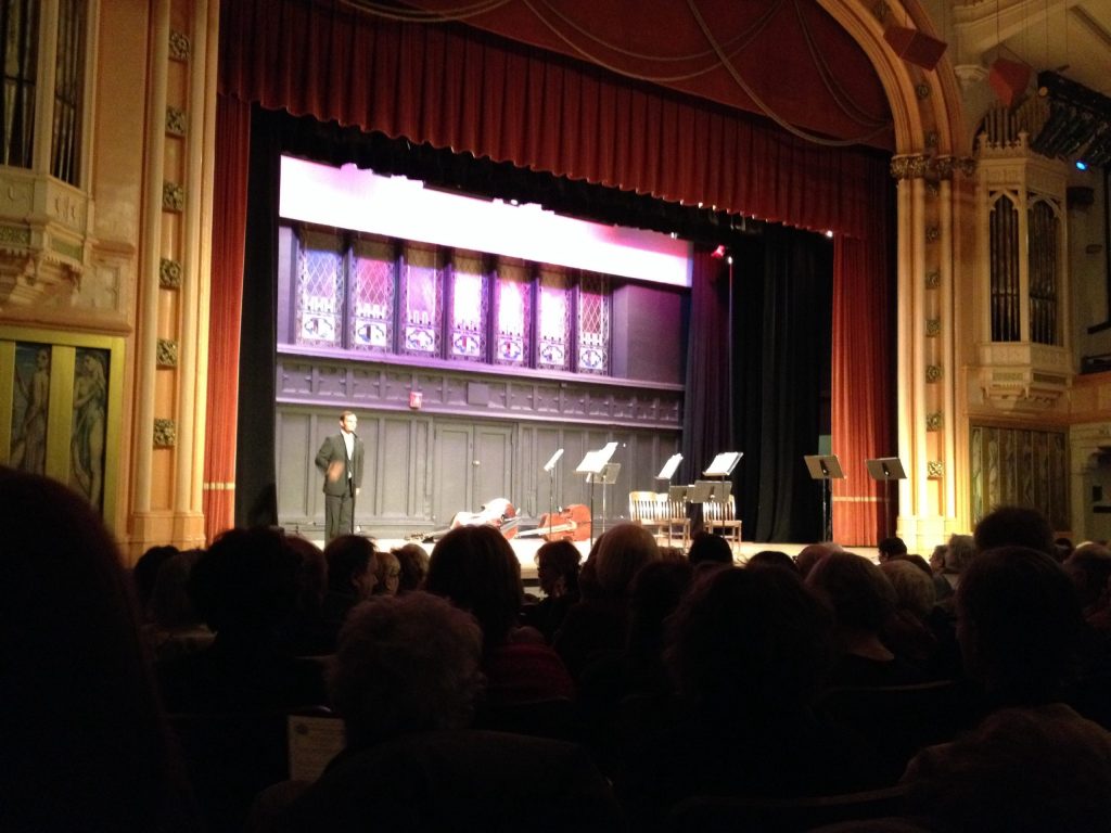 The Announcer introducing the East Coast Chamber Orchestra at Washington Irving Highschool