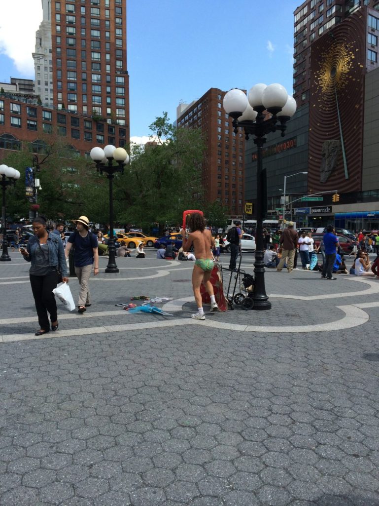 A crazy guy dancing with a toilet seat. He usually does this by the large black cube at Astor Place.