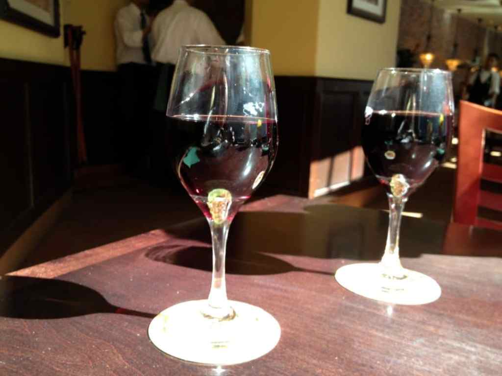 Two glasses of Olive Garden Rosso House Wine