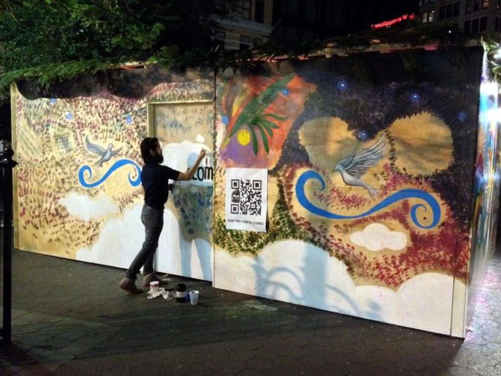 Some guy painting over the decorations