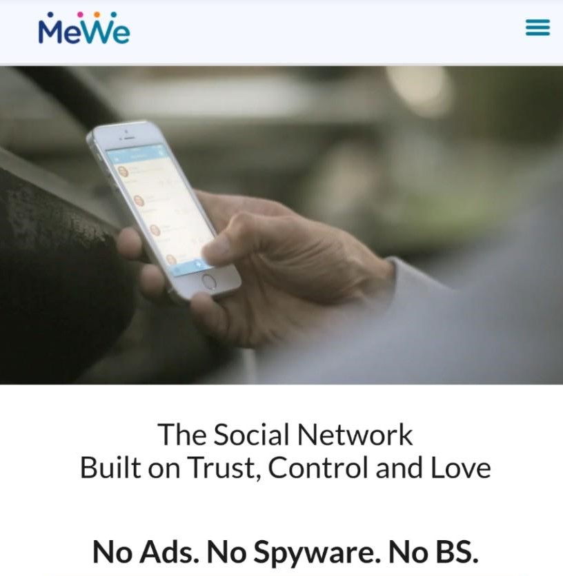 A screenshot of a sign-up page for MeWe including an image of a hand holding a smartphone showing MeWe and the text "The Social Network Built on Trust, Control and Love; No Ads. No Spyware. No BS."